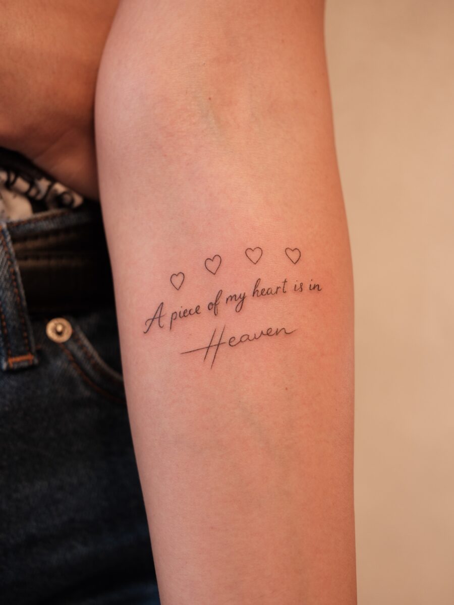 Heartfelt tribute with elegant script tattoo