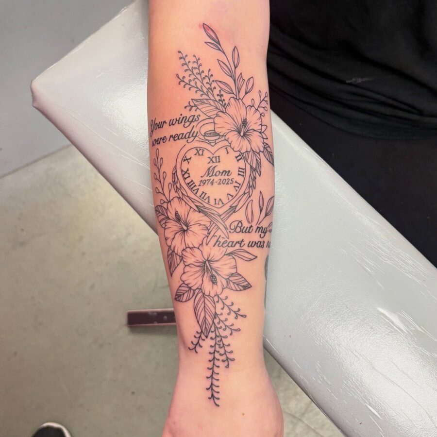 Delicate floral tribute tattoo honoring a mother