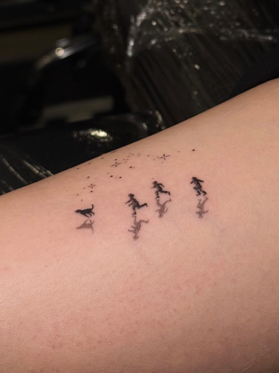 Elegant Tattoo of Running Figures with Stars