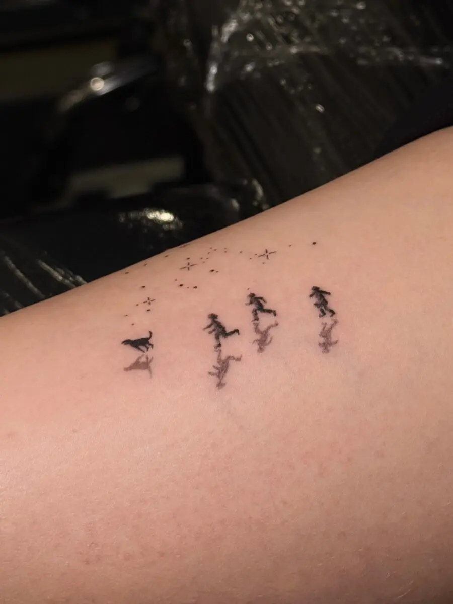 Elegant Tattoo of Running Figures with Stars