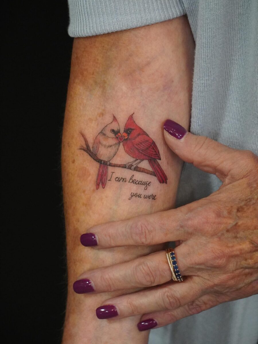 Heartfelt remembrance through colorful bird tattoos