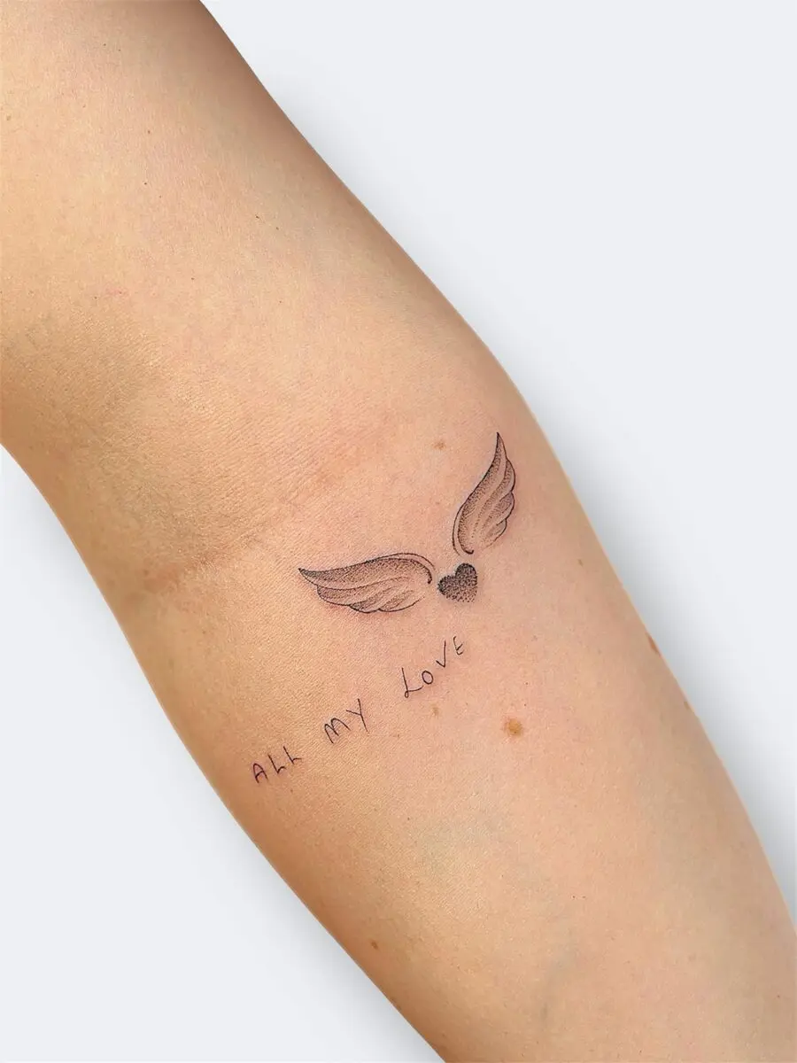 Heartfelt tribute with angel wings and lettering