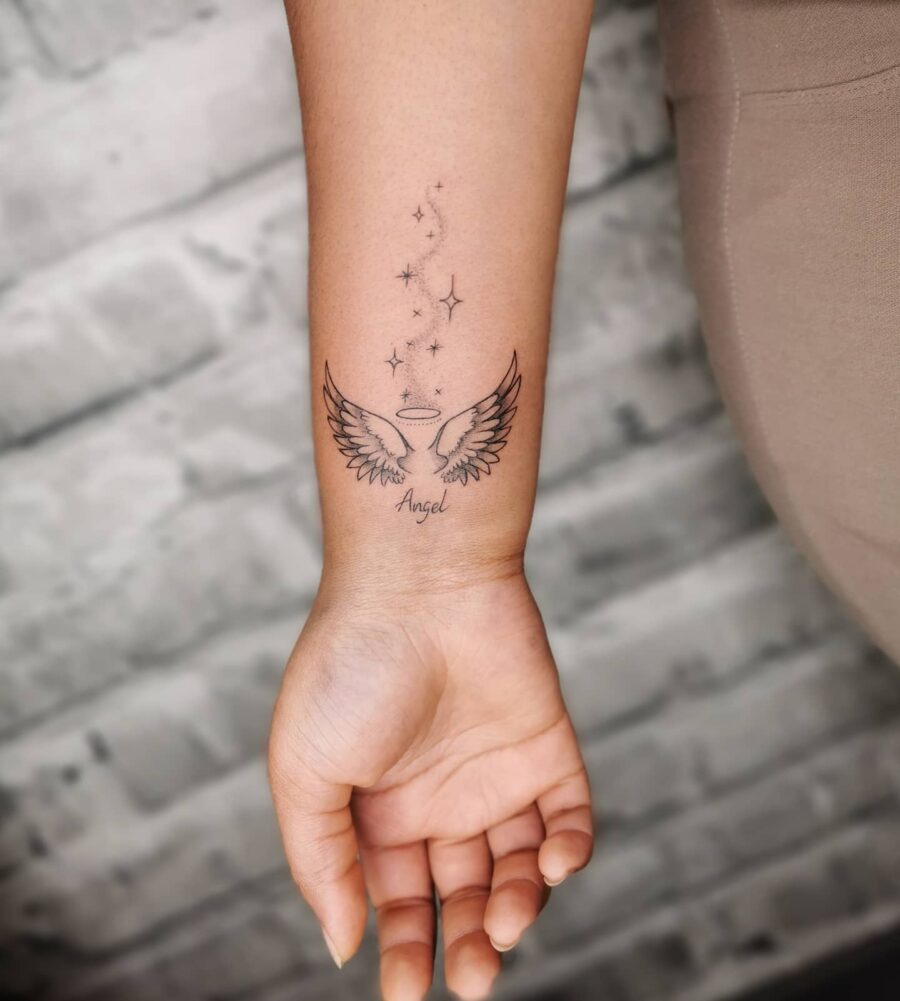 Elegant angel wings with shining stars tattoo