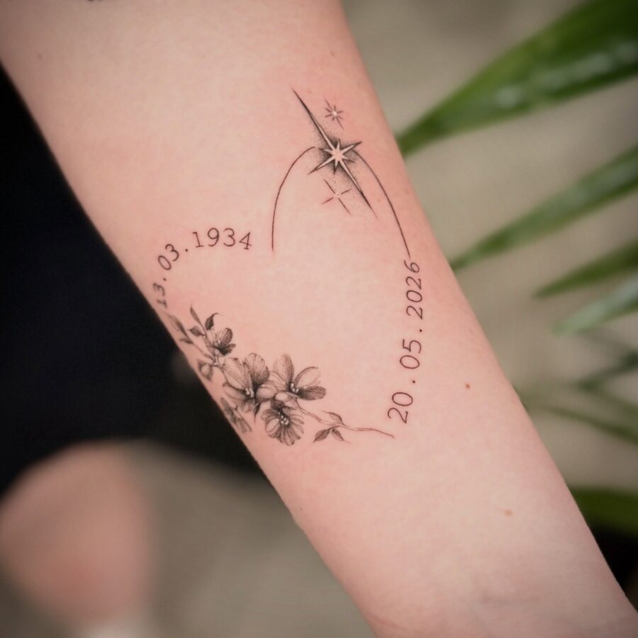 Elegant memorial tattoo with flowers and dates
