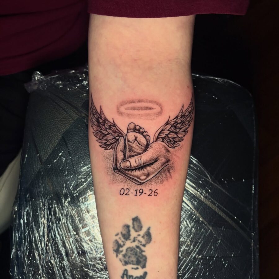 Symbolic tribute with angelic elements tattoo