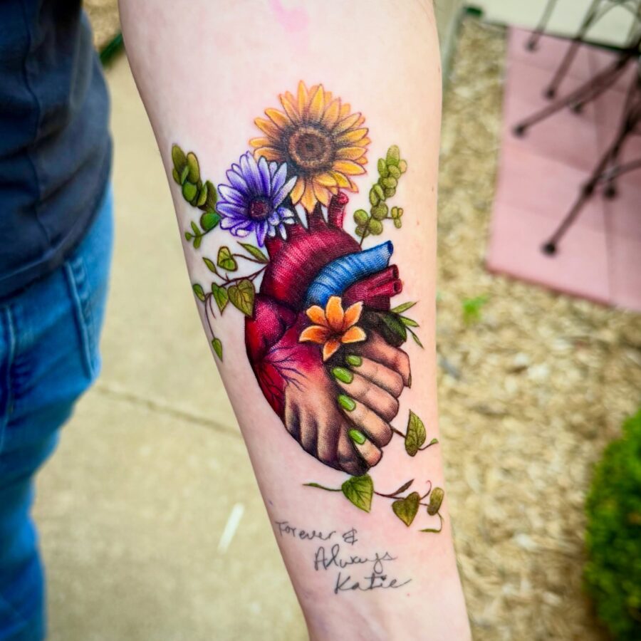 A vibrant tribute tattoo with floral elements