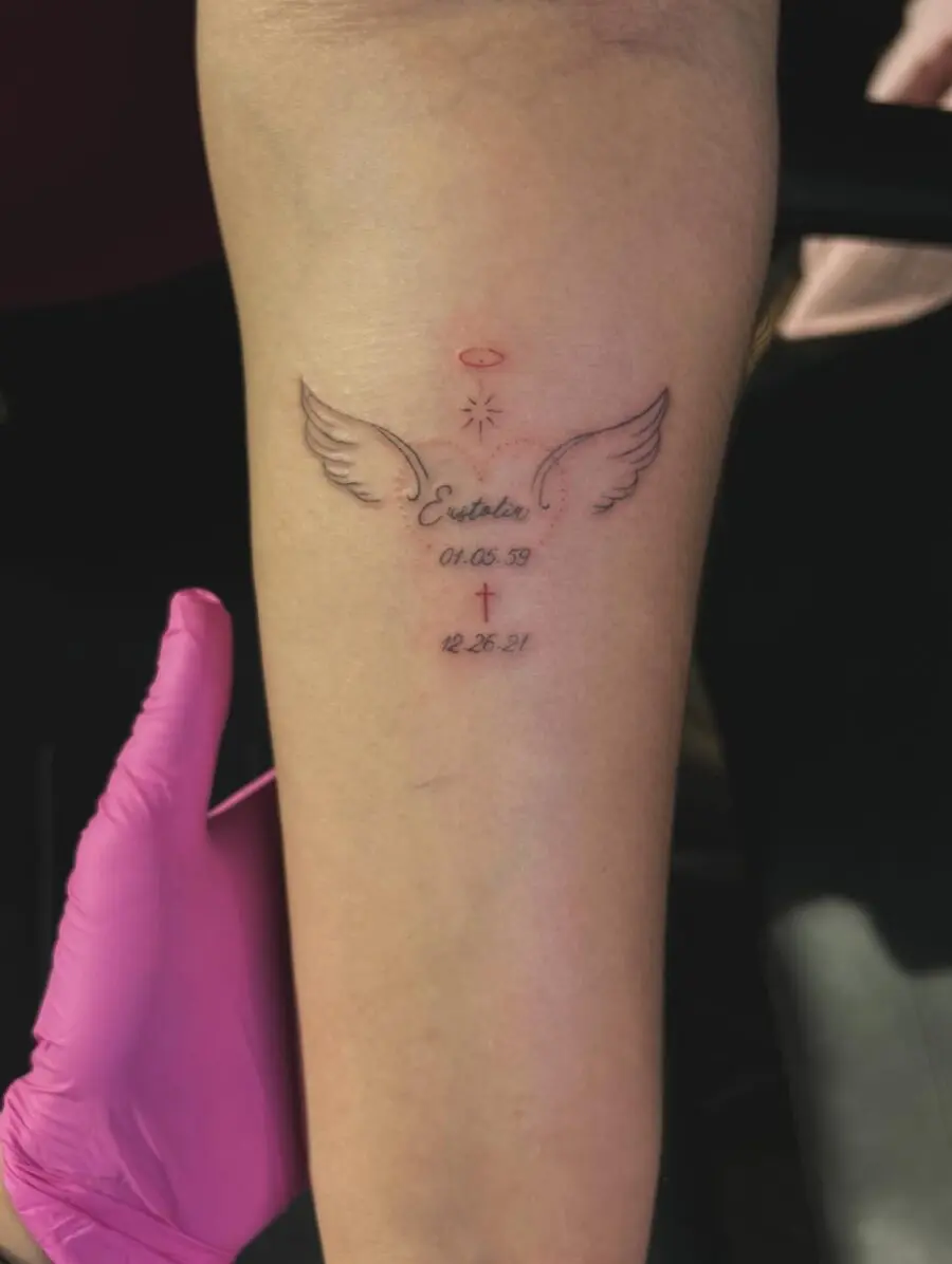 Elegant tribute tattoo with angelic motifs