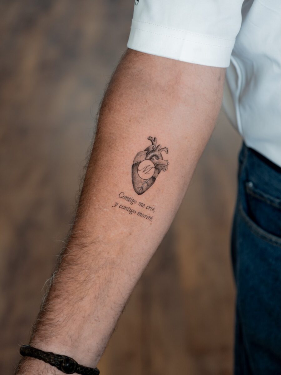 Heart tattoo with a touching quote