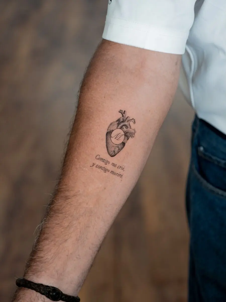 Heart tattoo with a touching quote