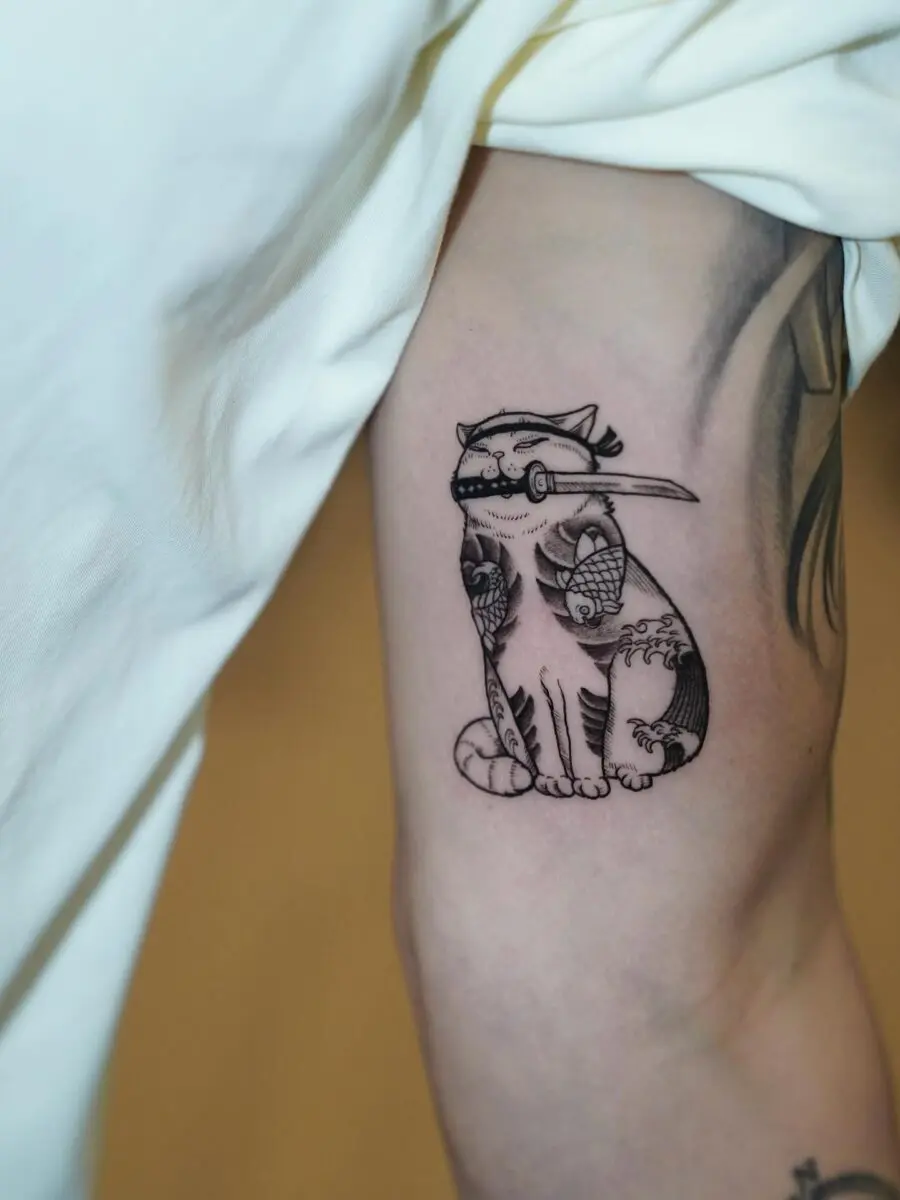 Sleek and Stylish Japanese Cat Tattoo