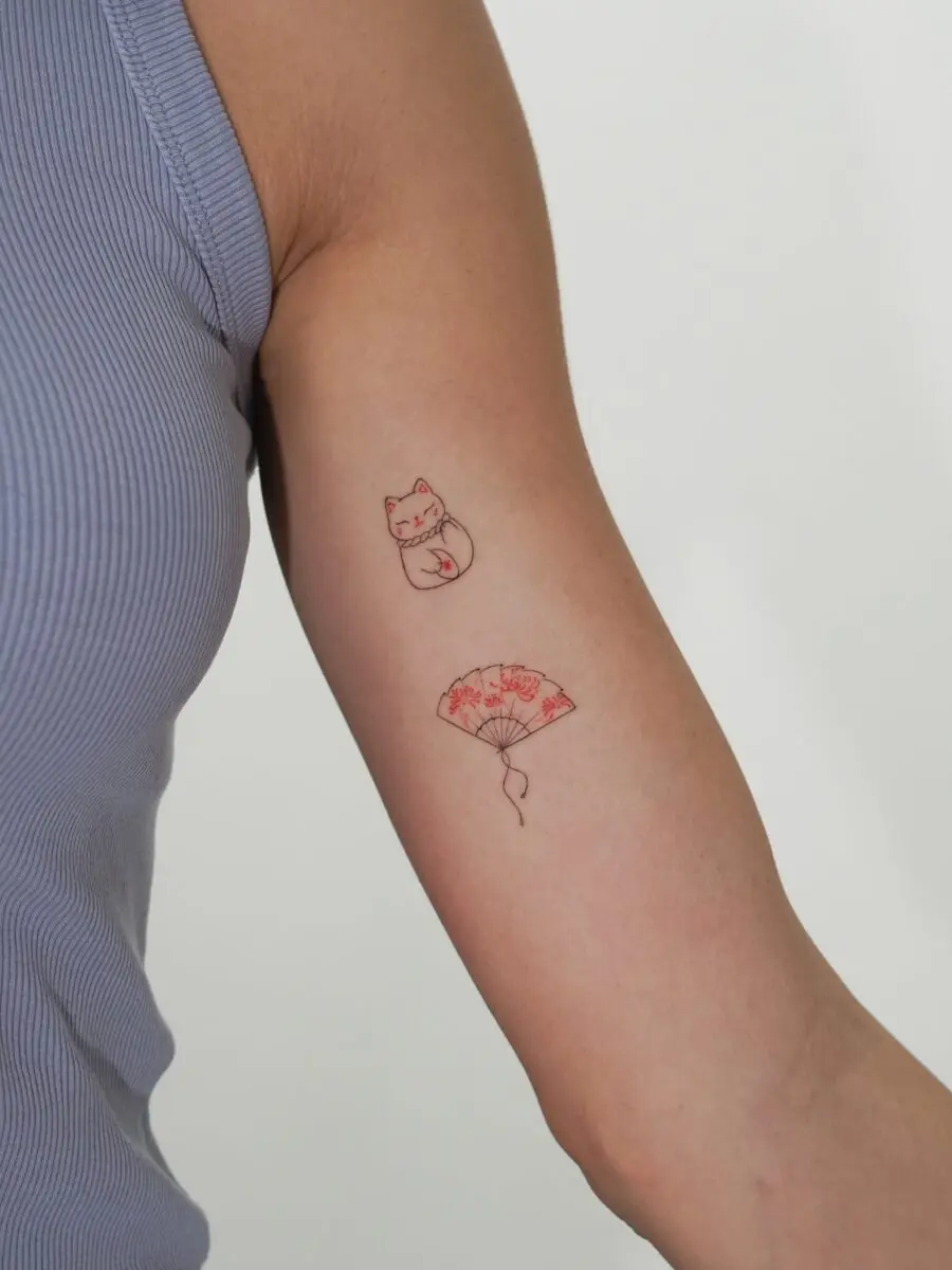 Unique Japanese tattoos featuring a cat and fan