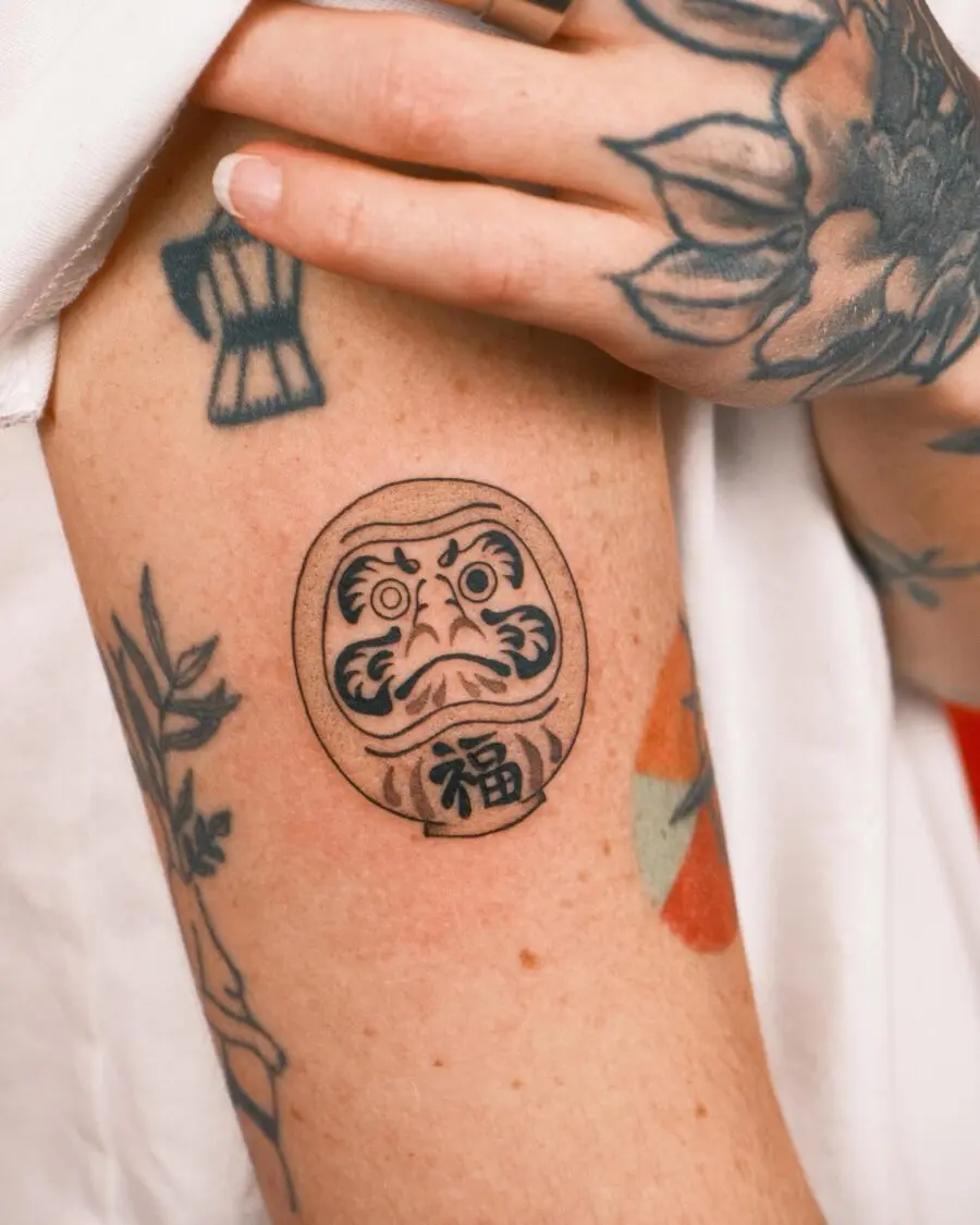 Symbolic Daruma Tattoo Artwork on Skin
