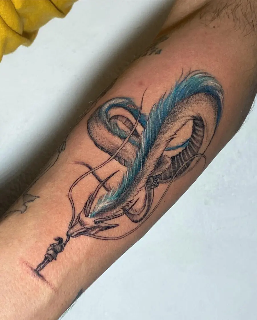Intricate Japanese dragon tattoo with vibrant blue accents