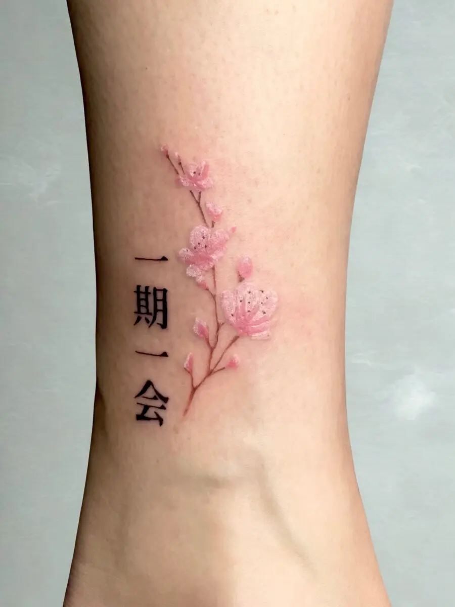 Elegant Japanese flower tattoo with meaningful text