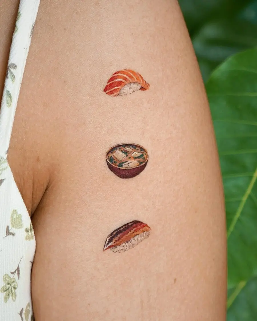 Expressive sushi tattoos reflecting Japanese culinary art