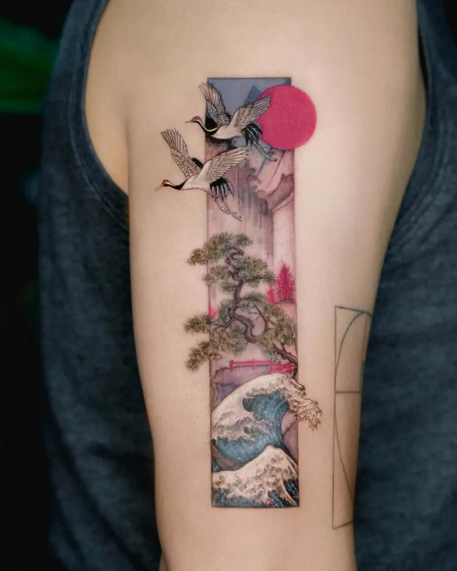 Elegant Japanese tattoo featuring cranes and waves