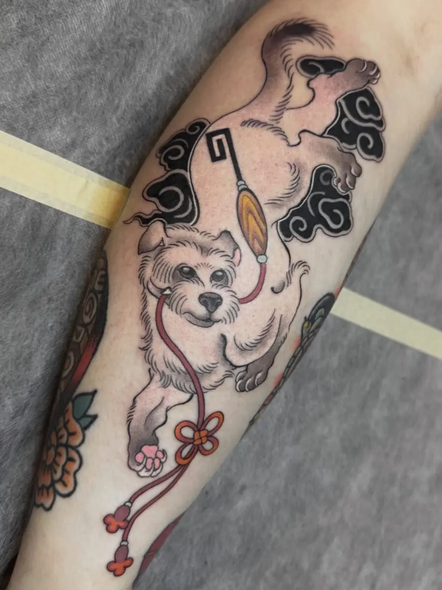 Japanese dog tattoo with playful elements