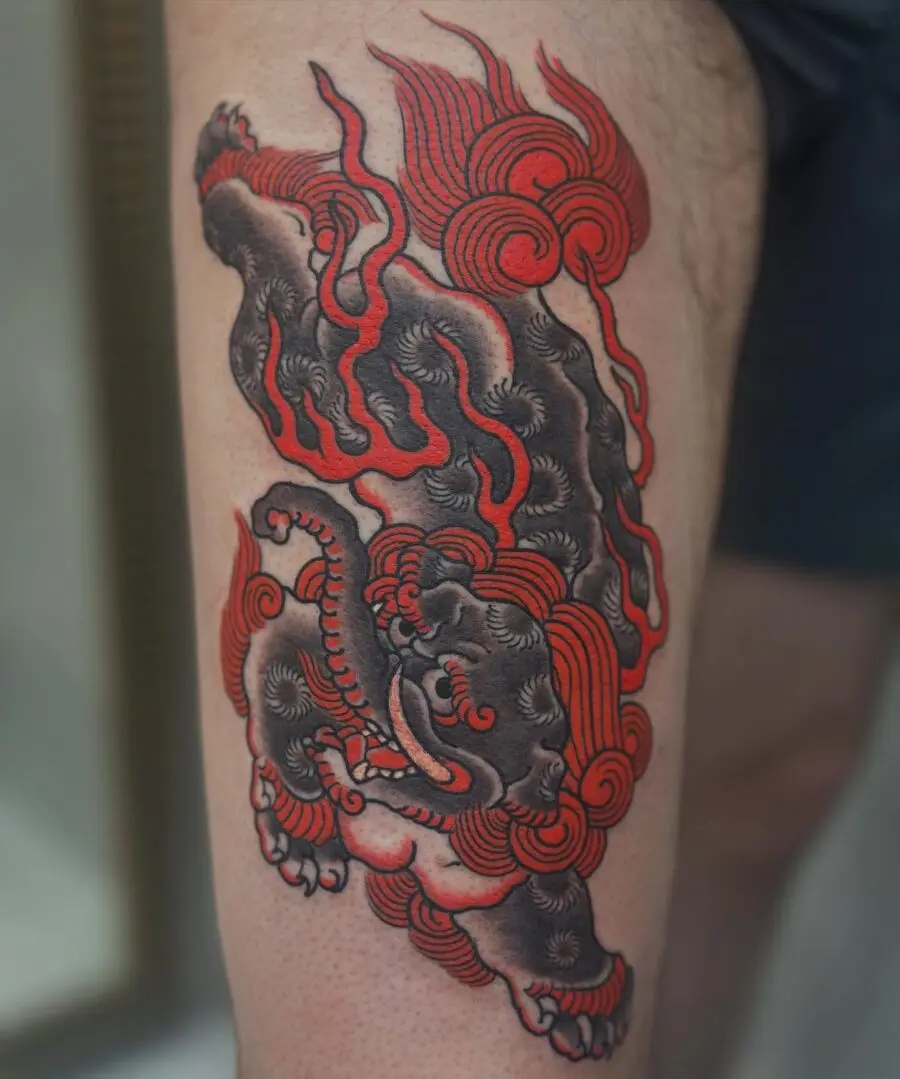 Vibrant Japanese tattoo of a fiery dragon