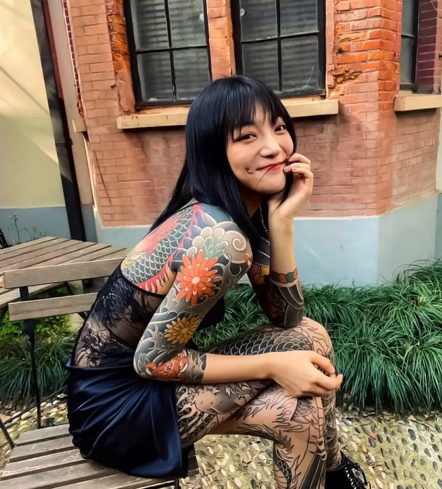 Colorful Japanese Tattoos on a Smiling Model