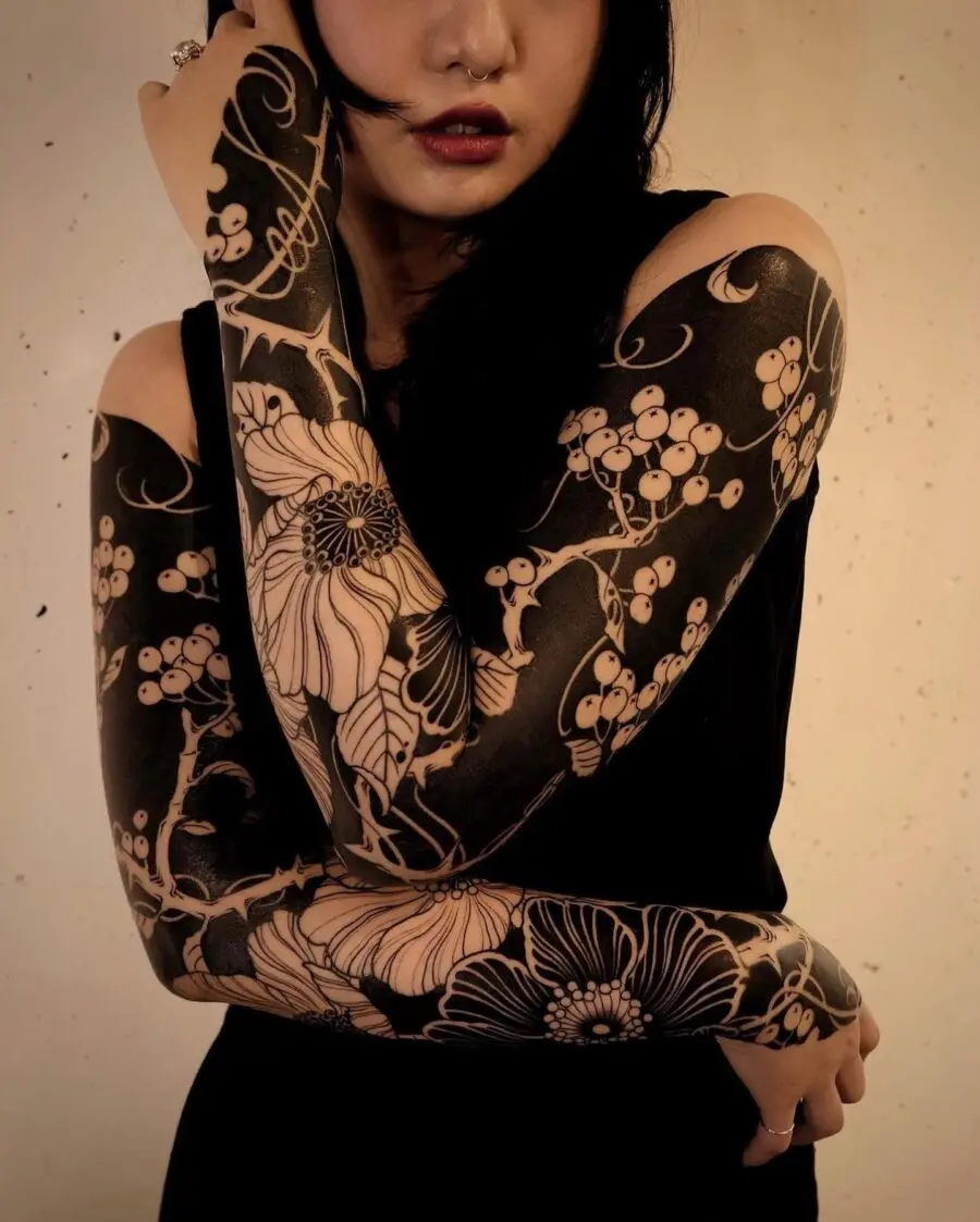 Stunning black floral sleeve tattoo design