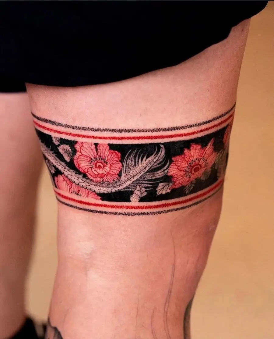 Elegant Japanese floral tattoo on the thigh