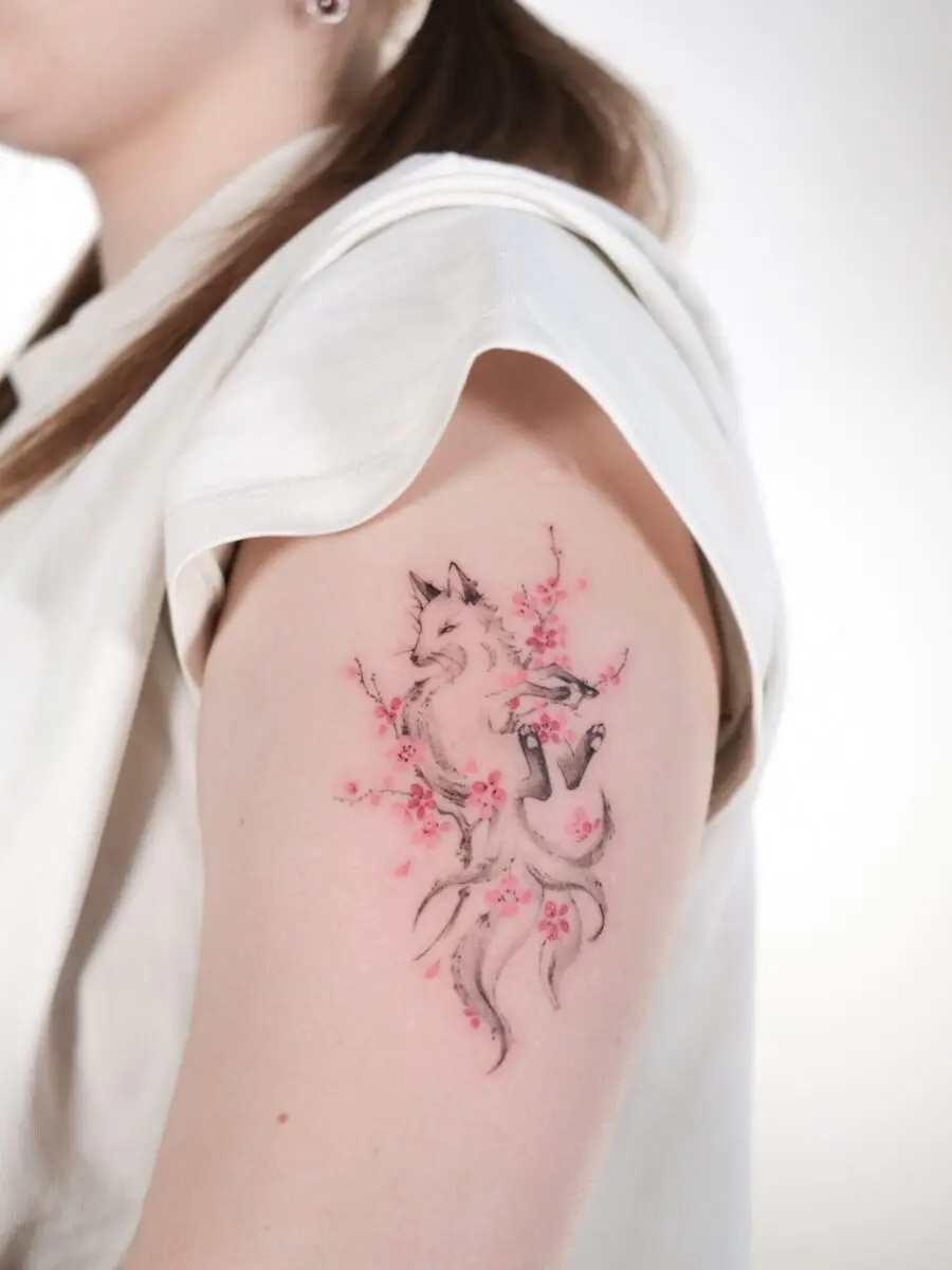 Elegant fox tattoo with cherry blossoms
