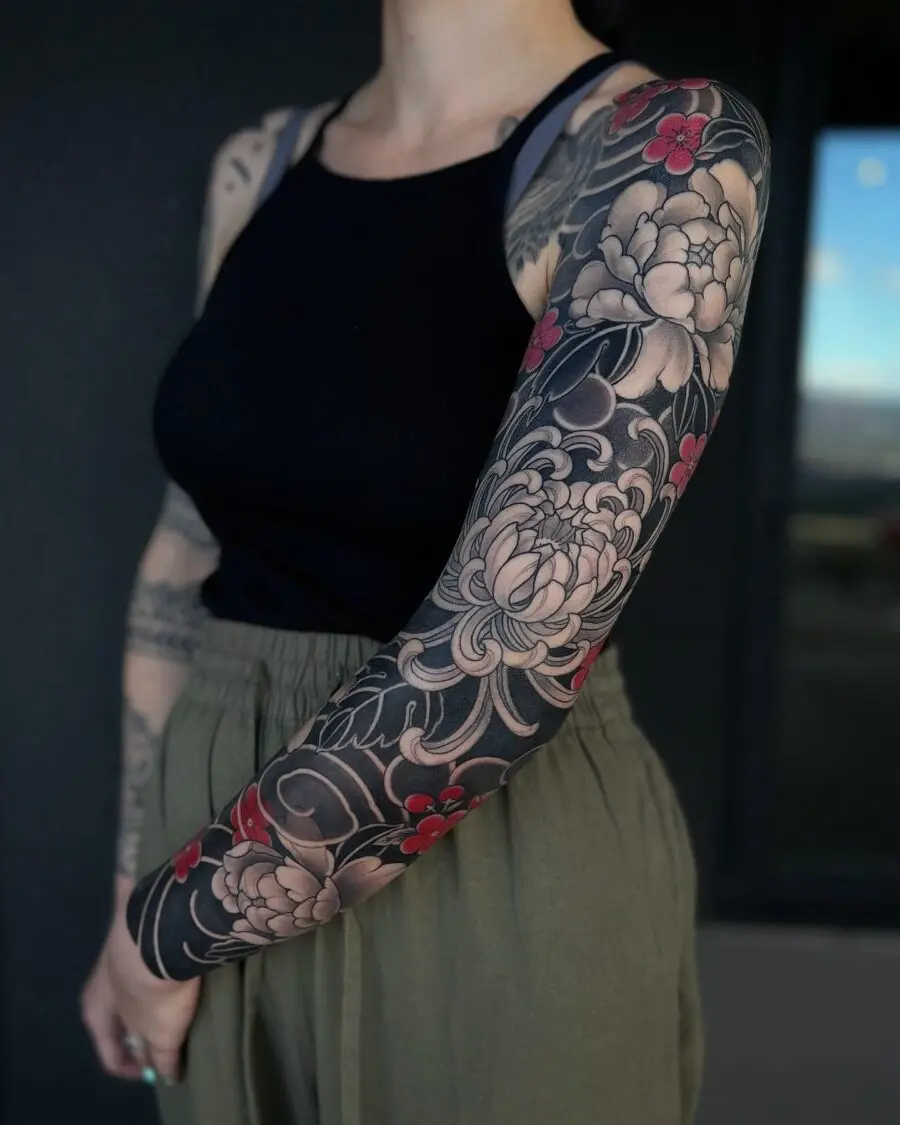 Intricate Japanese floral sleeve tattoo art