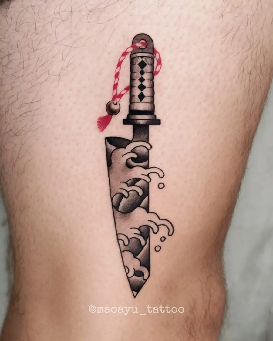 Intricate Japanese Knife Tattoo with Waves