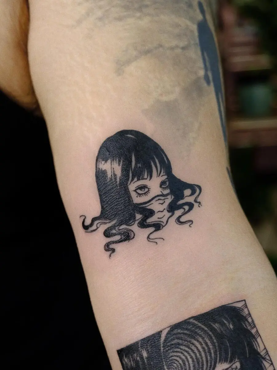 Intricate Japanese tattoo depicting a woman’s face