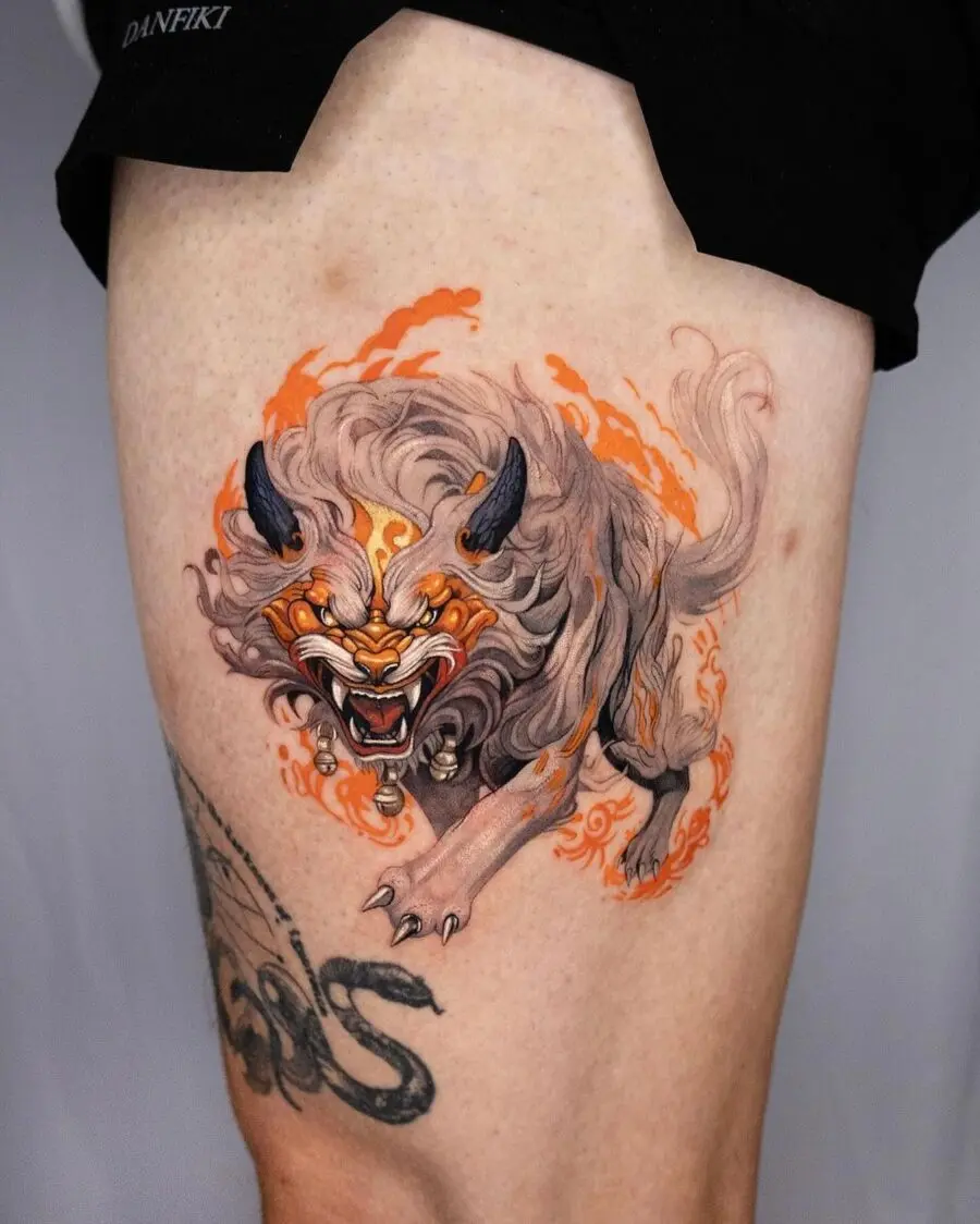 Vibrant Japanese tattoo of a fierce creature