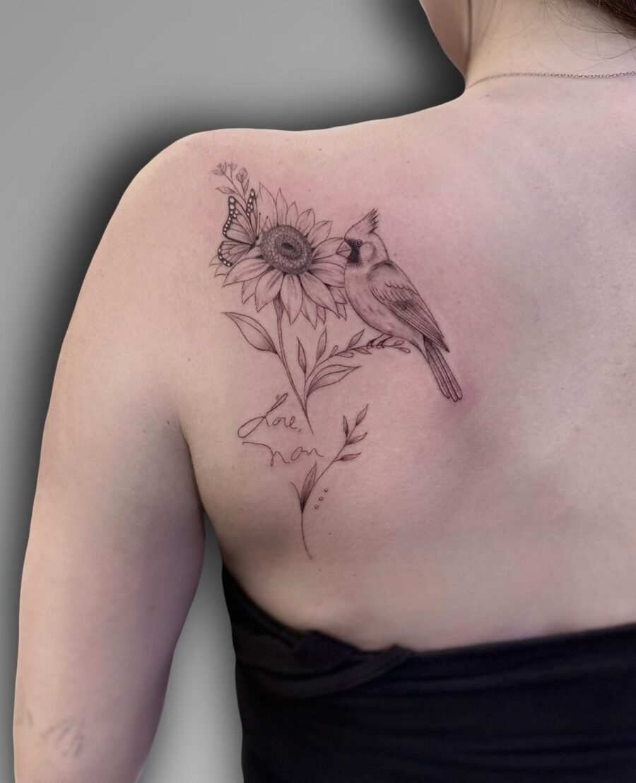 Elegant tribute tattoo featuring a bird and sunflower