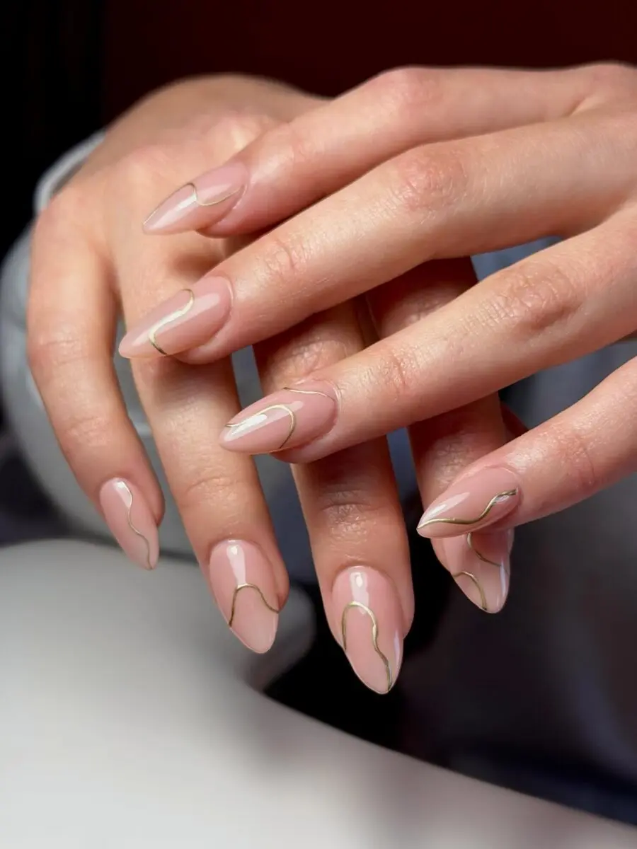 Elegant minimalist nails with golden accents