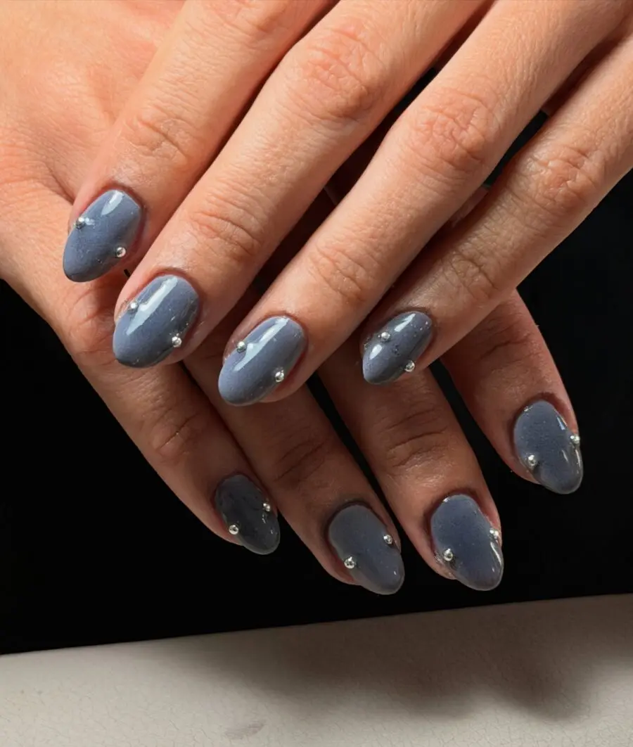 Elegant gray minimalist nails with stud accents