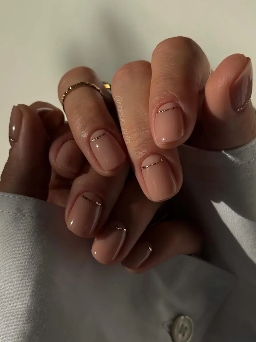 Elegant minimalist nails with subtle gold accents