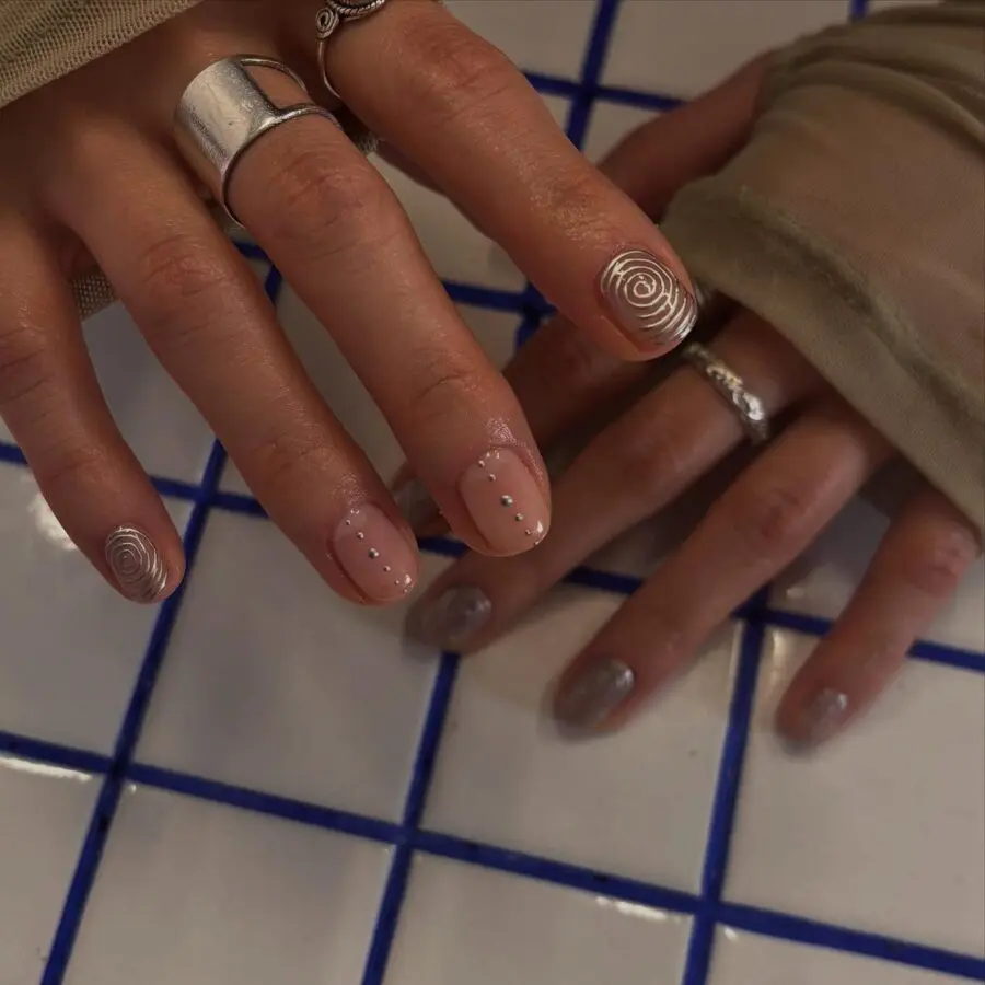 Chic minimalist nail design with playful swirls