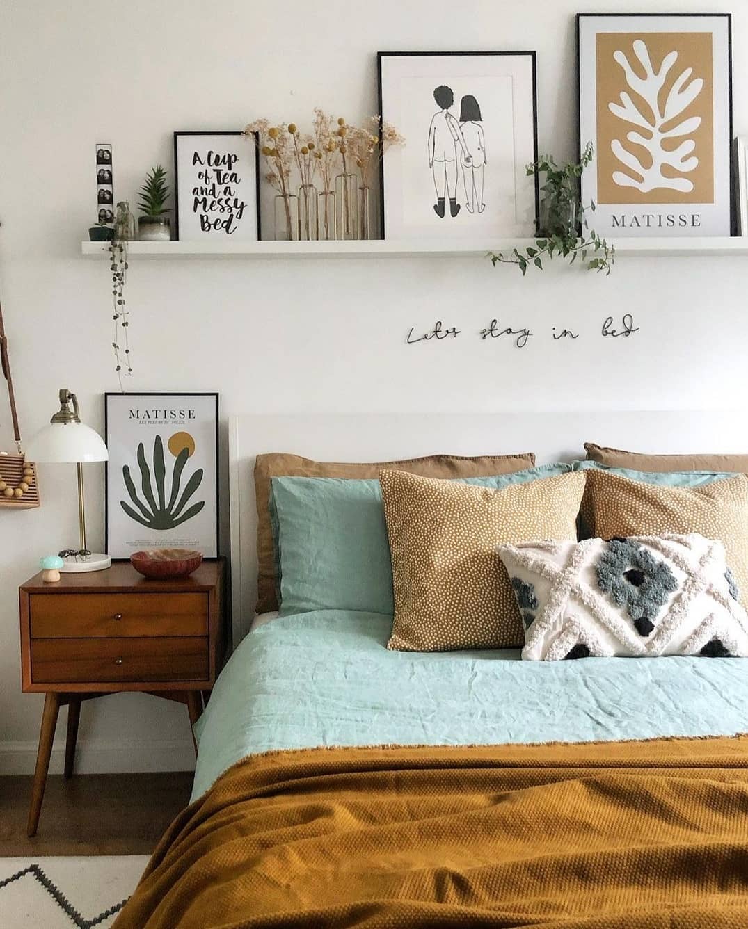 Stylish above-bed decor for a cozy vibe