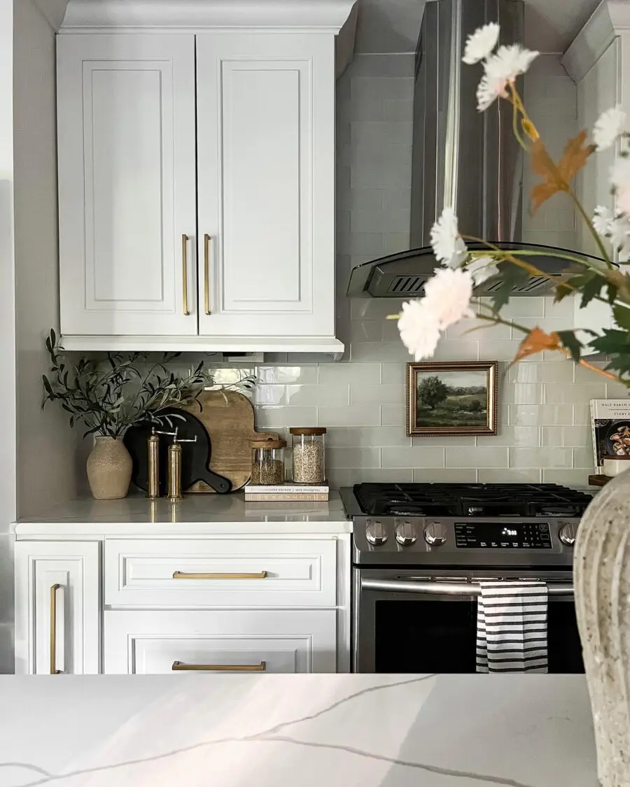 Elegant kitchen counter with art and greenery