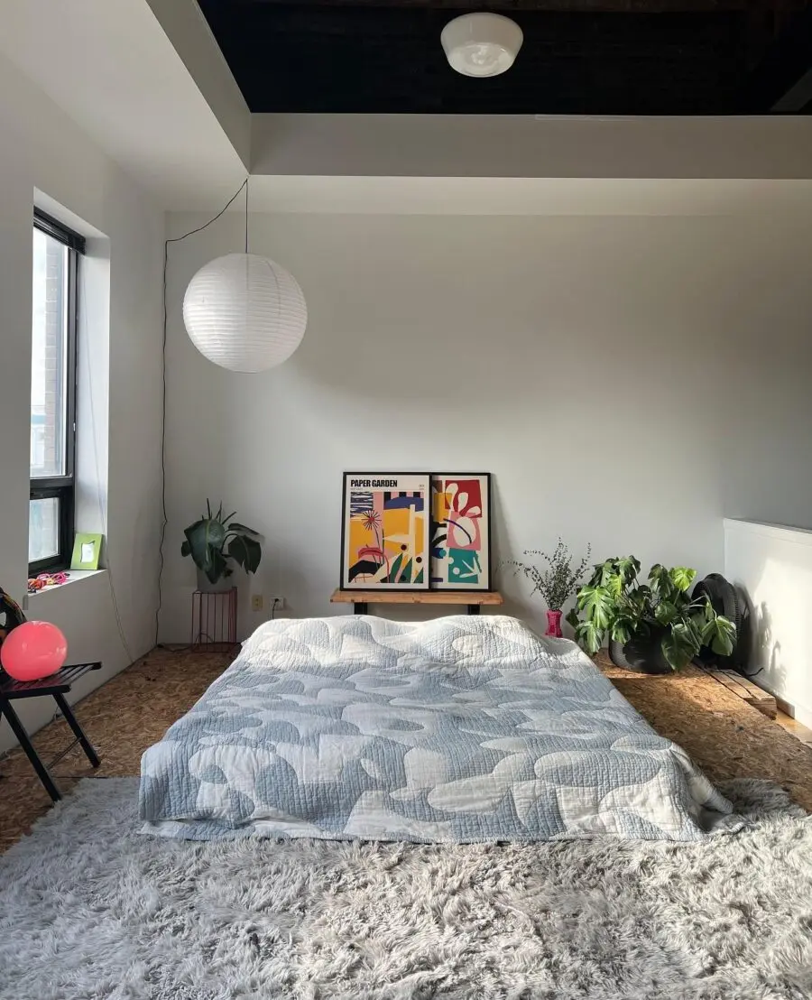 Chic bedroom setup with vibrant art pieces