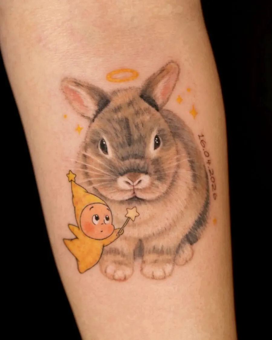 Charming rabbit memorial tattoo with angelic touch