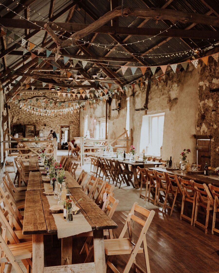 Charming barn setting with rustic wood tables