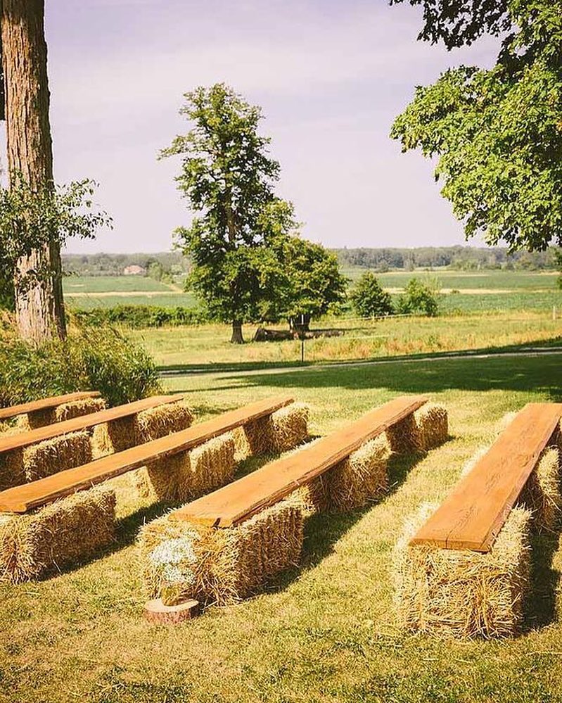 Charming outdoor seating with hay bale accents
