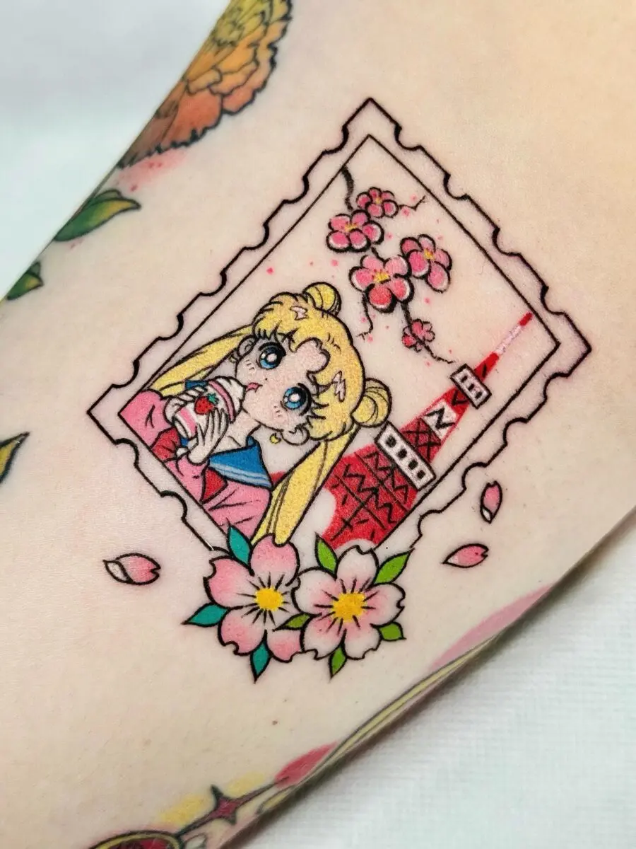 Charming Sailor Moon Tattoo with Sakura Elements