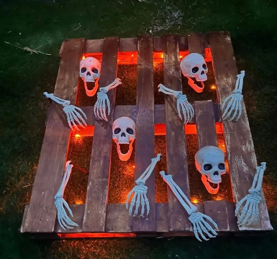 Chilling Skeletons on a Wooden Pallet Display