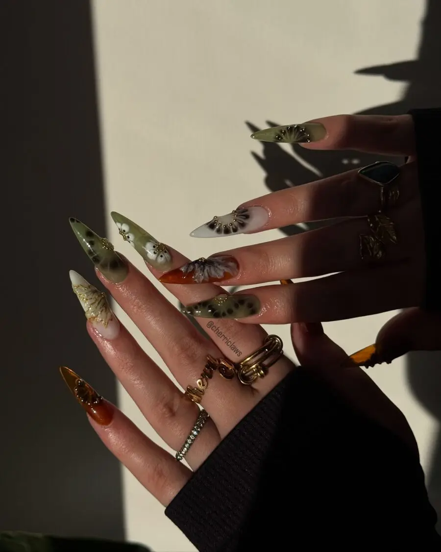 Elegant stiletto nails with unique floral designs