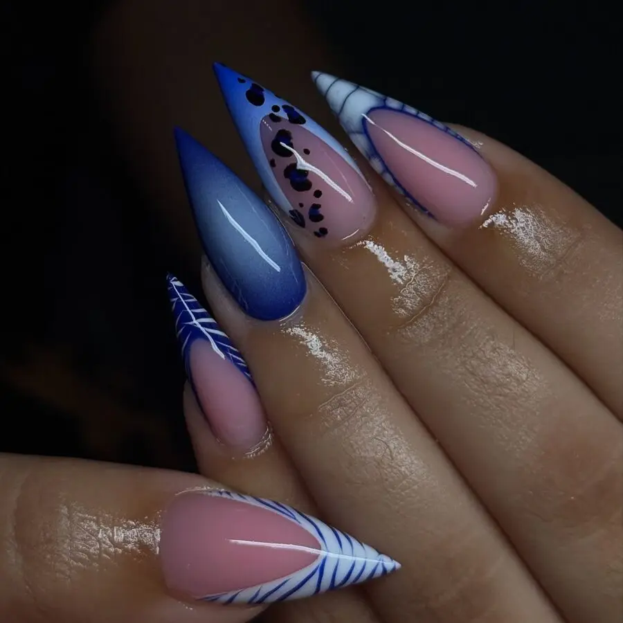 Vibrant stiletto nails with bold artistry