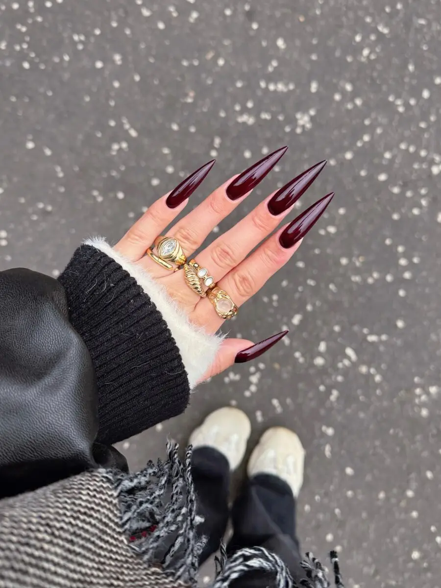 Chic burgundy stiletto nails with rings