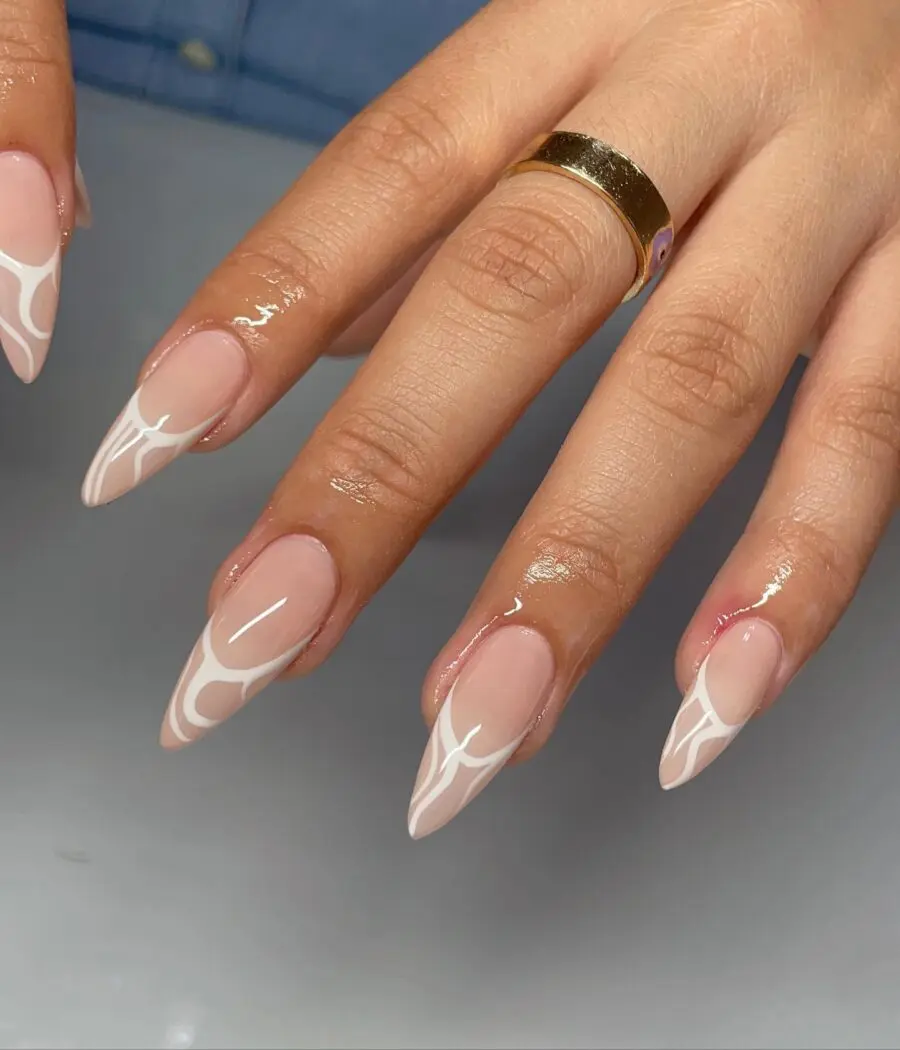 Elegant stiletto nails with chic white design