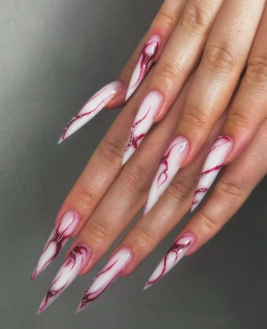 Elegant stiletto nails with pink accents