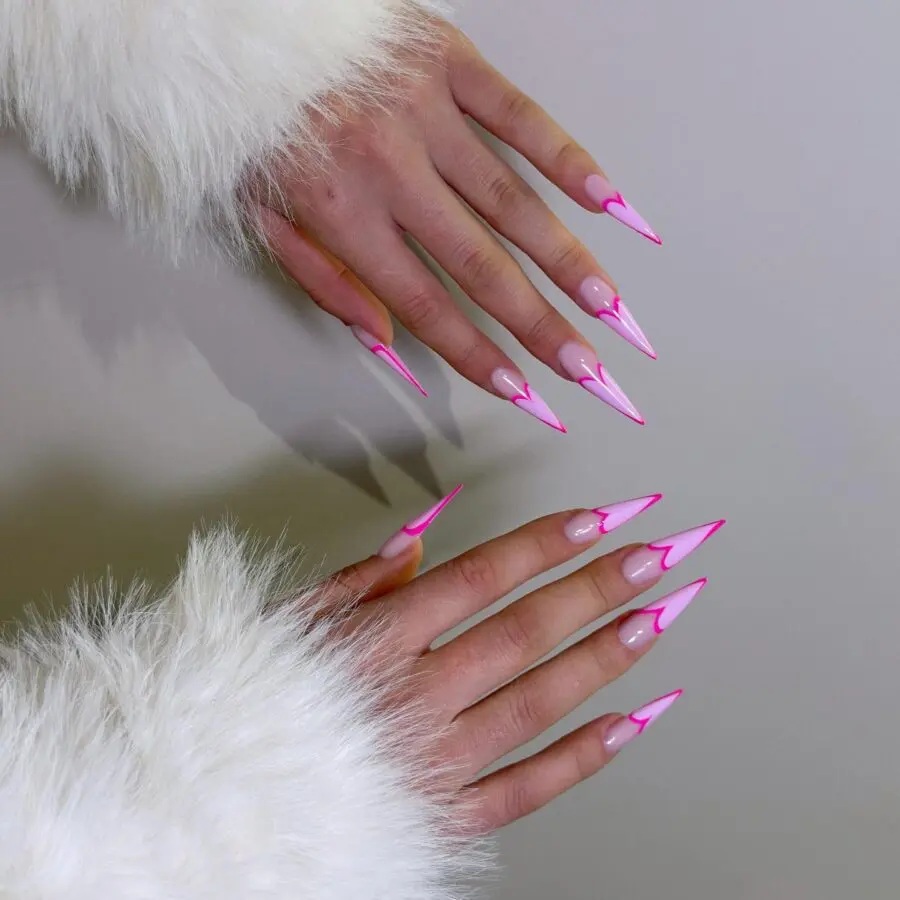 Vibrant pink stiletto nails with a stylish finish