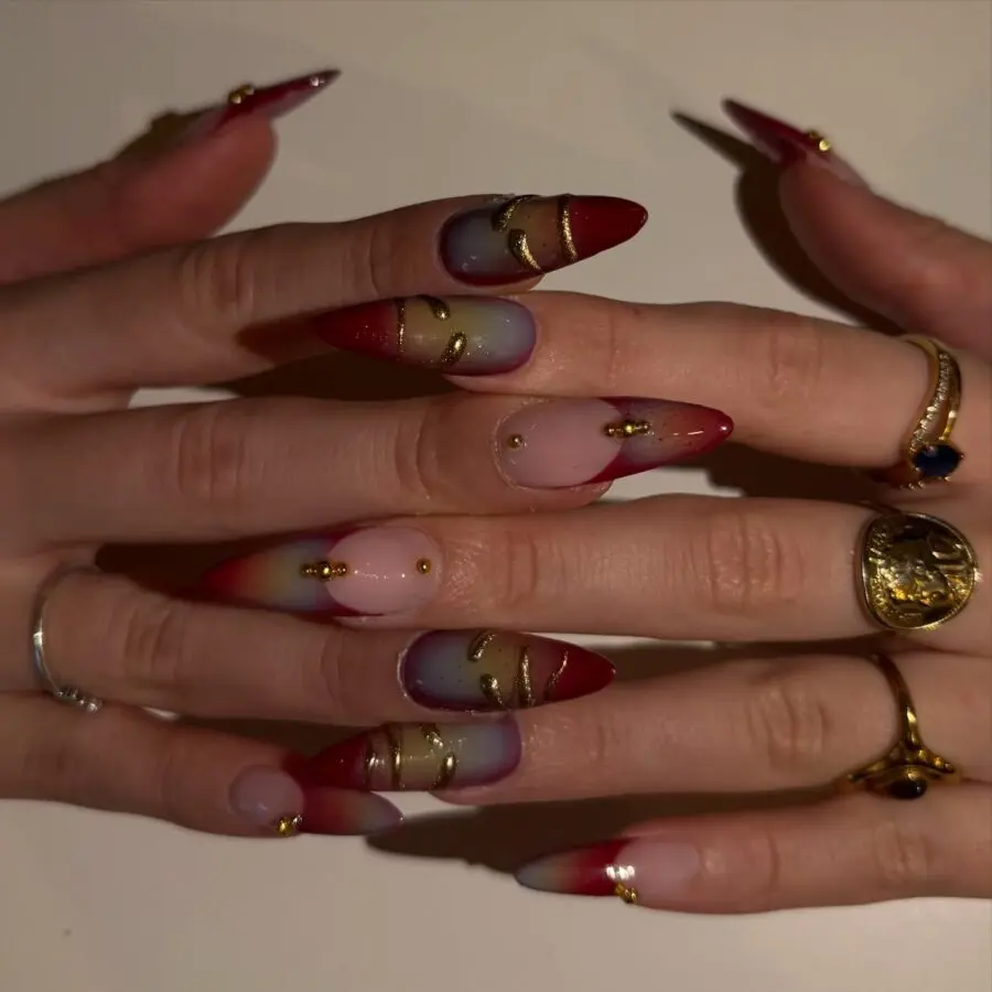 Elegant stiletto nails with gold accents